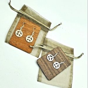 Handmade sterling silver and natural white howlite peace sign earrings.